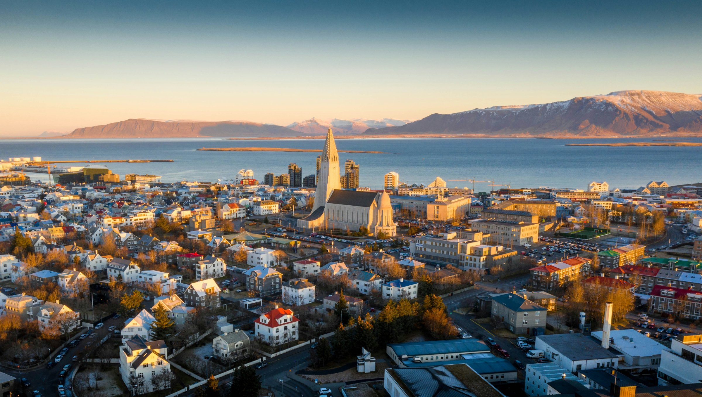 Downtown Reykjavík with brightly painted houses and the Hallgrímskirkja spire.