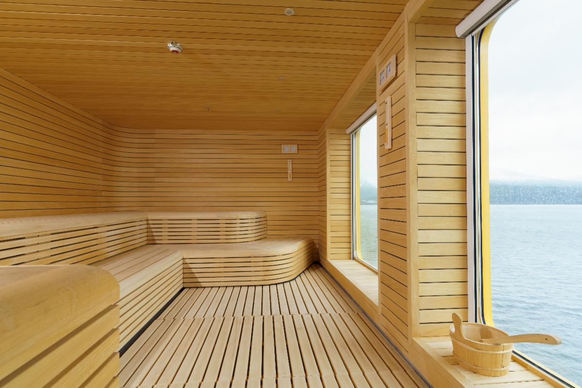 Ultramarine's cedar sauna with a floor-to-ceiling window onto the sea.